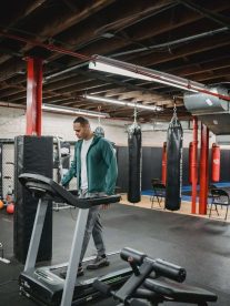 Man working out on a treadmill in a MiFitness gym